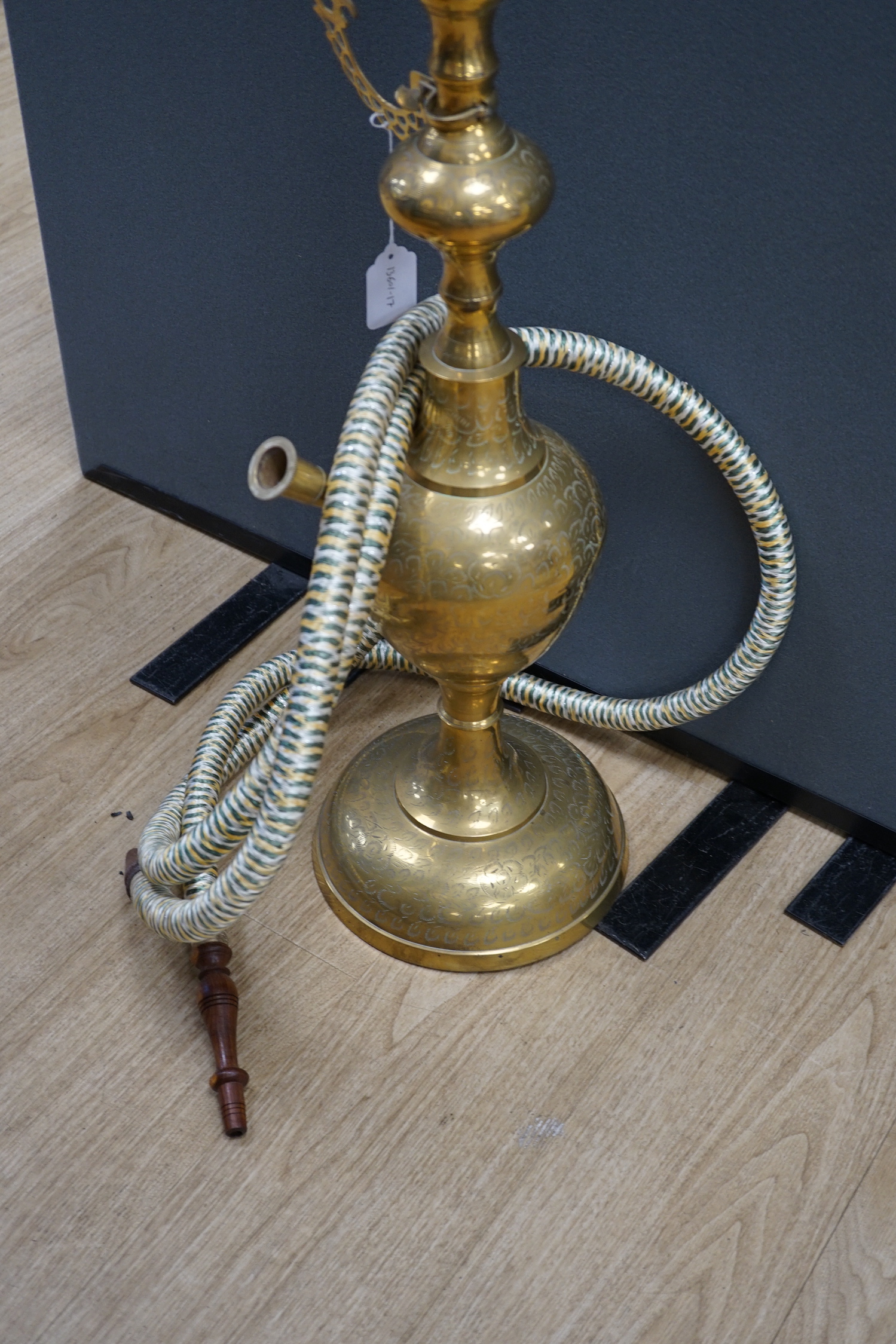 A large Middle Eastern brass hookah, 154cm